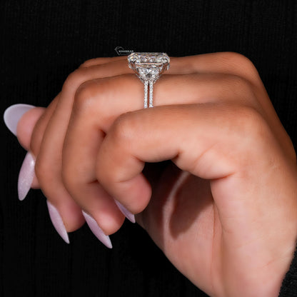 Engagement ring with white metal split shank, elongated cushion-cut clear center stone, side profile on finger view
